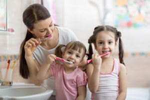 Family Brushing teeth together